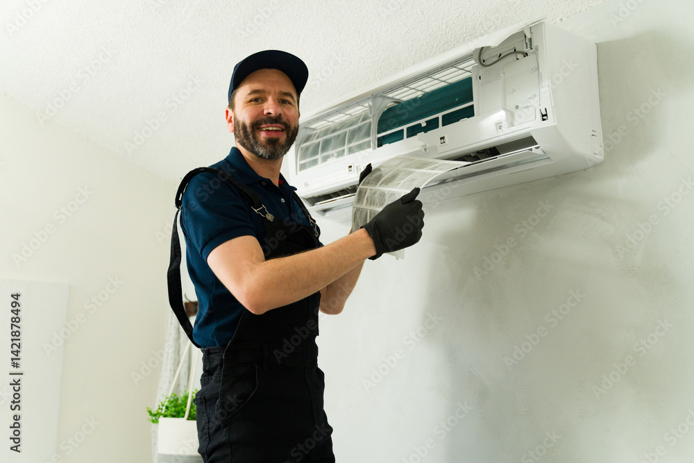 Hvac technician cleaning air conditioner filter during maintenance service