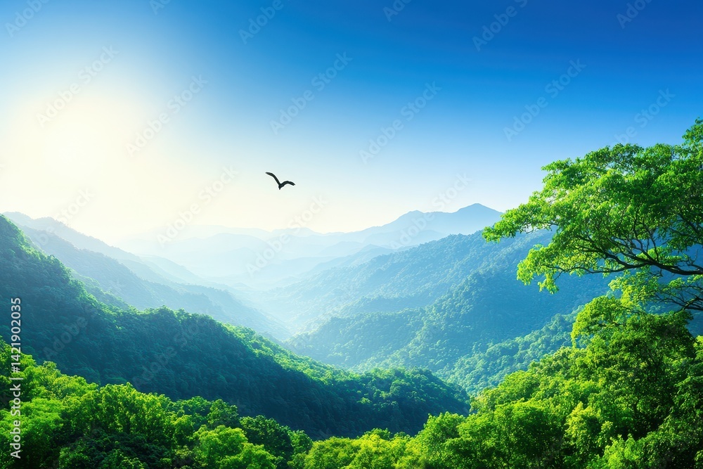 Obraz premium A serene mountainous landscape with lush greenery, rolling hills, and a clear blue sky, showcasing nature's beauty and tranquility.