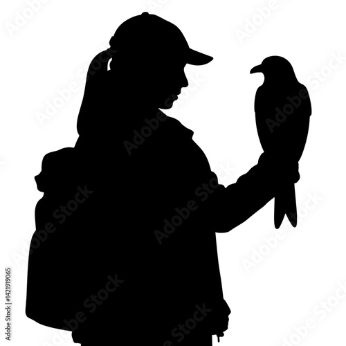 Silhouette of bird handler gently holding falcon, connection with nature