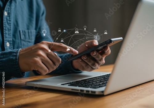 Businessman Using Mobilephone and Laptop for Social Media Analitic
