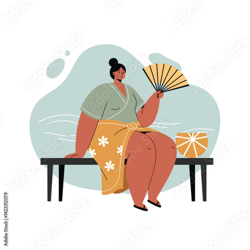 Woman sitting on bench using handheld fan in casual summer outfit with floral skirt and green top 