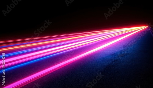Neon light streaks on dark surface