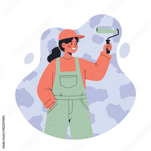 Young woman painter holding paint roller in casual outfit smiling and painting wall with green paint in creative work environment 