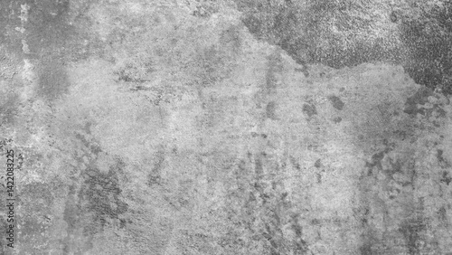 Gray rough textured abstract background.  A grey wall with a few stains and cracks. The wall is made of concrete and has a rough texture
