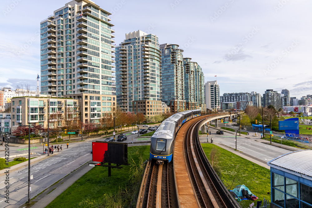 Naklejka premium Modern Cityscape with Elevated Train in Downtown Vancouver, BC, Canada
