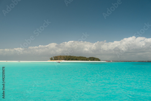Canvastavla Serene turquoise waters surrounding mnemba atoll