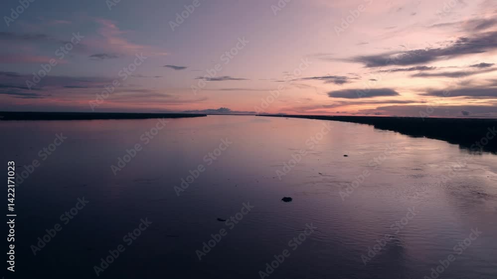 Sunset Over the Amazon River in the Jungle - Amazonas, Puerto Nariño, Colombia Sunset Over the Amazon River in the Jungle - Amazonas, Puerto Nariño, Colombia