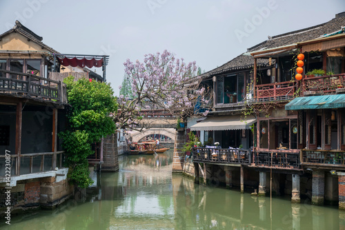 Restaurant along canal with tourist boats at Zhujiajiao water town