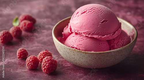 Obraz na płótnie Raspberry gelato with smooth texture and vibrant red color served in a small bowl w salonie