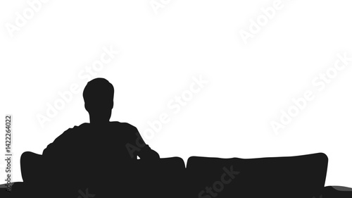 Lonely man sitting in silence on couch in silhouette
