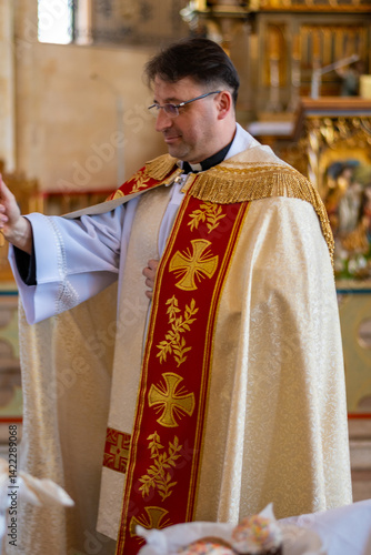 Canvastavla Catholic priest blesses parishioners with holy water on Easter Vigil