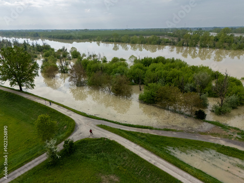 Aerial view capturing the flooded Po River in Emilia Romagna, Italy, with submerged trees and fields illustrating disaster impact