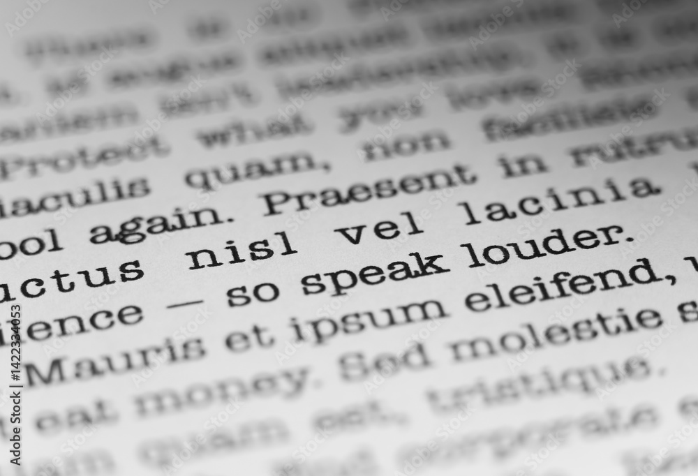 Speak louder. Encouraging text printed on a page. A piece of paper with a phrase written in retro typewriter font. Speak louder. Encouraging text printed on a page. A piece of paper with a phrase written in retro typewriter font.