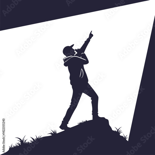 Silhouette of person pointing in spotlight on dark background
