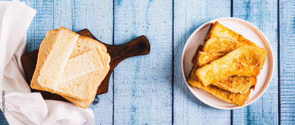 Traditional fried french toasts on white plate on table top view web banner
