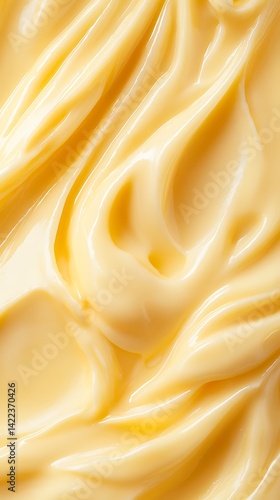 Yellow Cream Texture Background Thick, Wavy, Shiny Cosmetic Emulsion Closeup