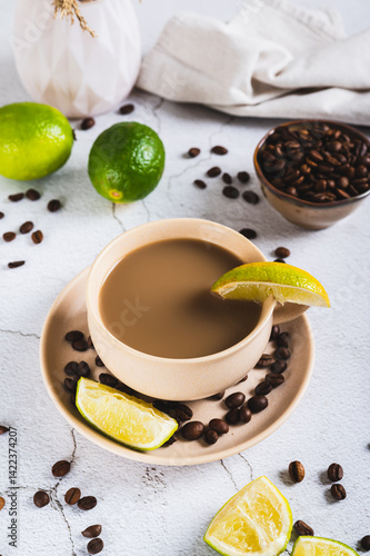 Obraz na płótnie A cup of latte infused with lime on the table vertical view w salonie