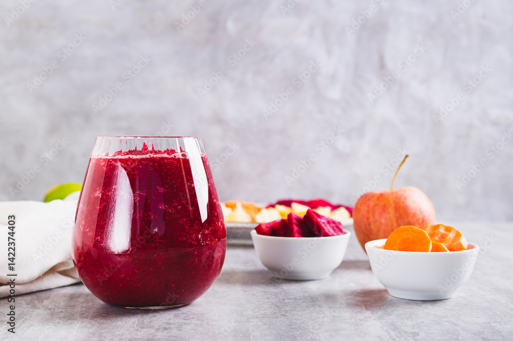 ABC juice from beetroot, carrot and apple for detox in a glass on the table