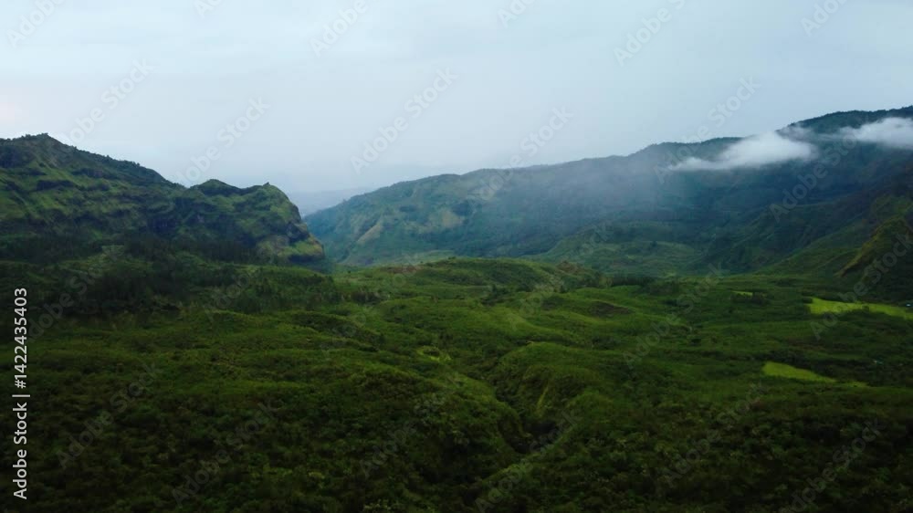 Aerial view beautiful panorama of mountains and fluffy white clouds somewhere in Valley Lohe , South Sulawesi. Aerial view beautiful panorama of mountains and fluffy white clouds somewhere in Valley Lohe , South Sulawesi.