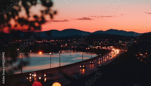 City lights reflecting on water at sunset