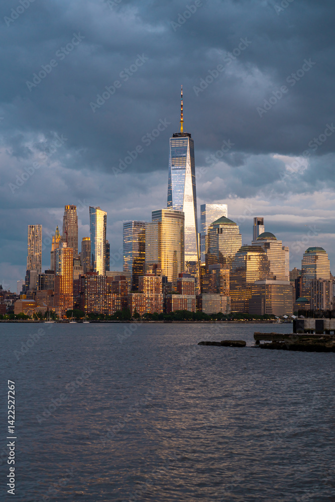 Obraz premium NYC, New York City Skyline with dramatic sky clouds. New York Skyscrapers. New York City skyline, cityscape of Manhattan in USA. Panoramic view on Manhattan. New York skyline. NYC, NY city.