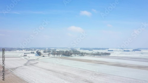 The Norman village asleep under the snow in Europe, in France, in Normandy, between Dieppe and Fecamp, in Winter, on a sunny day. 