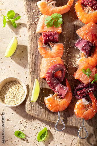 Preparation of spicy grilled skewer with coriander, sesame and lime.