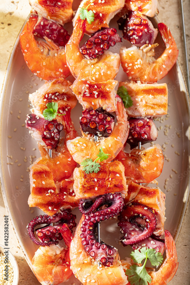 Tasty roasted skewer with shrimps and octopus.