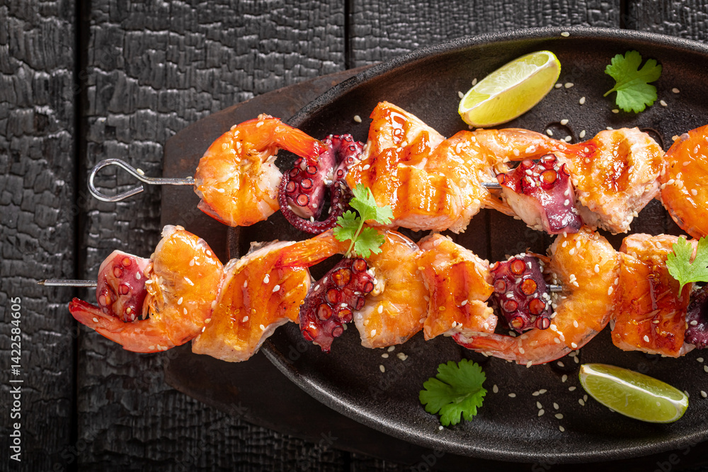 Fresh roasted skewer with octopus and salmon.