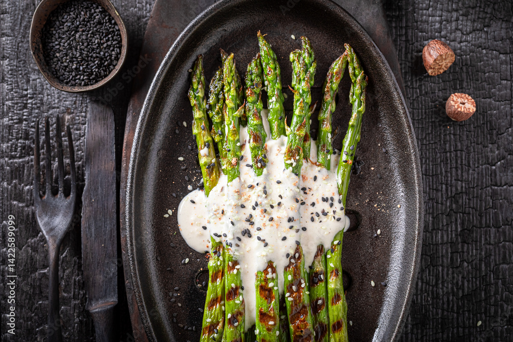 Green roasted asparagus as a summer delicacy.