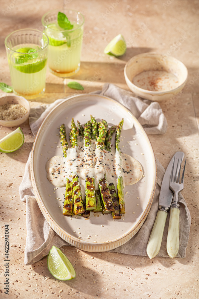 Fresh grilled asparagus with sesame and lime.