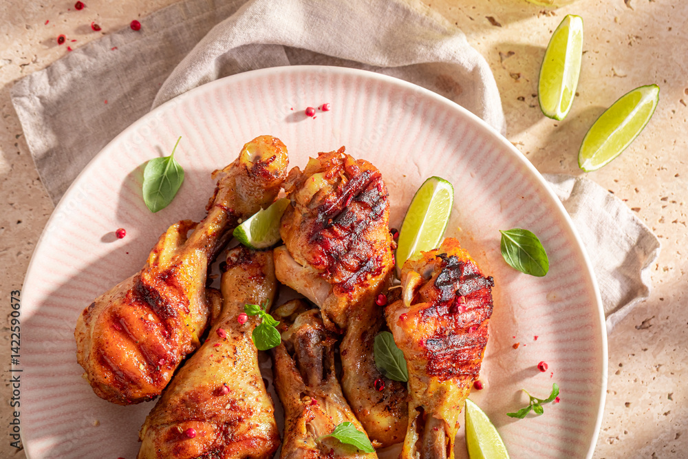 Tasty roasted chicken leg with spices and herbs.