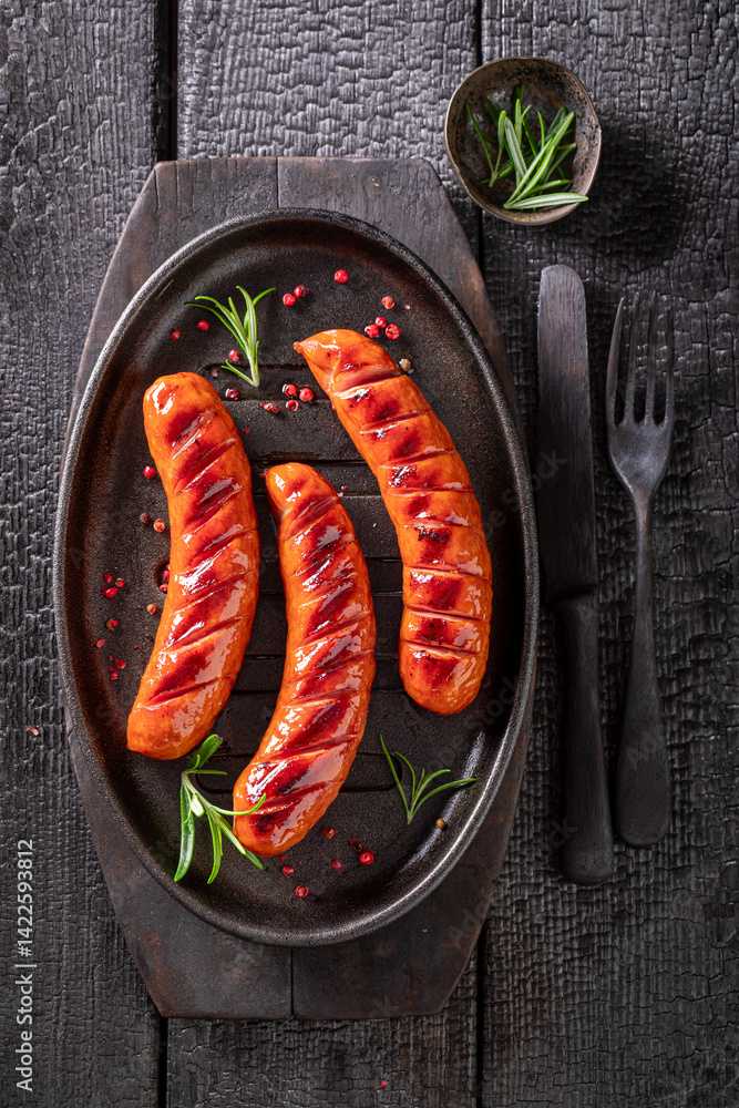 Spicy roasted sausage with sauces and lime.