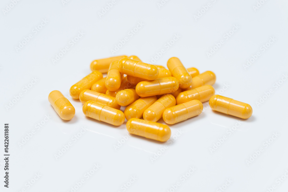 Yellow capsules in pile