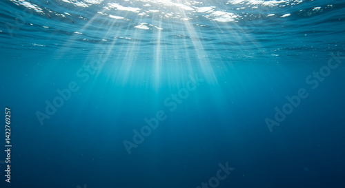 Sunlight filtering through deep blue water