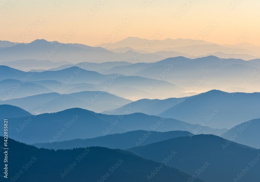 Obraz premium Layered Mountain Range at Dusk Hues of Blue and Gold