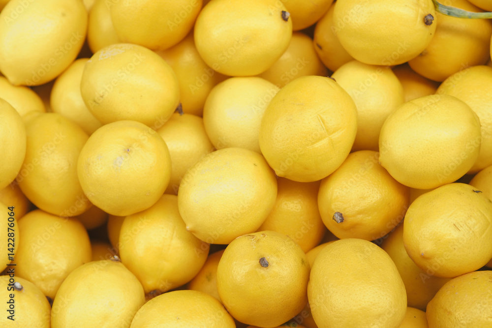 Freshly harvested lemons in a vibrant market display Freshly harvested lemons in a vibrant market display