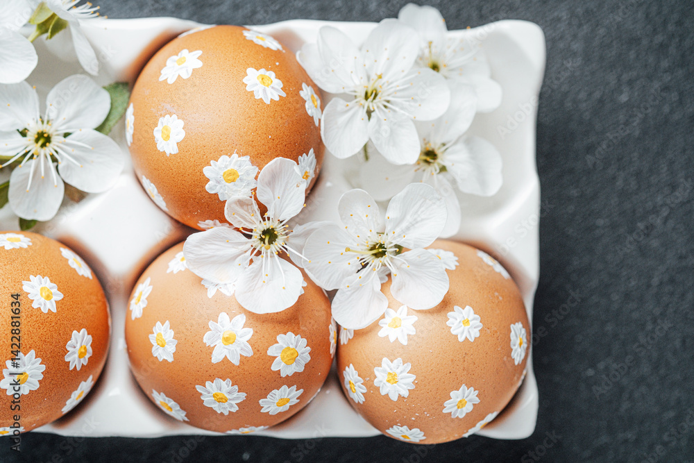 Fototapeta premium Spring celebration with decorated eggs and fresh flowers in a tray