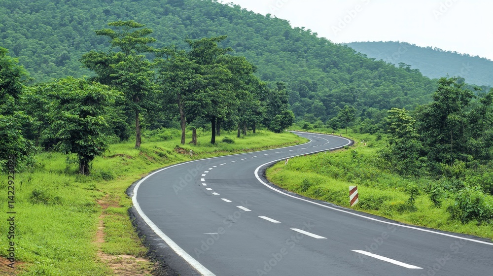 Fototapeta premium Scenic Curving Toll Road Through Isolated Green Hills