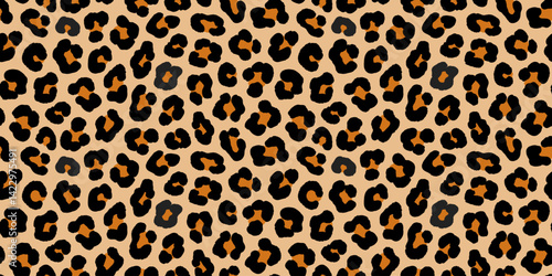 Seamless pattern with leopard texture with black and brown spots on beige backdrop. Fashion stylish wallpaper print design template. Animal jaguar skin background. Vector illustration