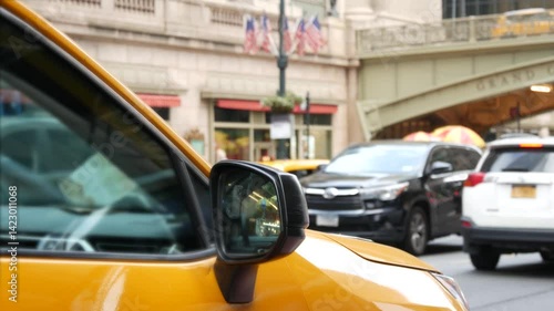 New York City Grand Central Terminal railway station, 42 street. Manhattan Midtown. Yellow taxi cab, car transport on Pershing Square, NYC, USA. American urban road traffic, people pedestrians. Bridge