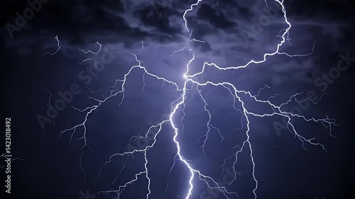 Dramatic lightning strikes in a stormy night sky