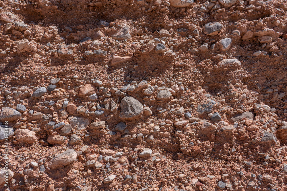 Fototapeta premium Gravelly basin fill alluvium, Calico Basin, Red Rock Canyon, Las Vegas, Clark County, Nevada. Mojave Desert. dry stream bed / Intermittent, temporary or seasonal rivers. Fluvial terrace. gravel