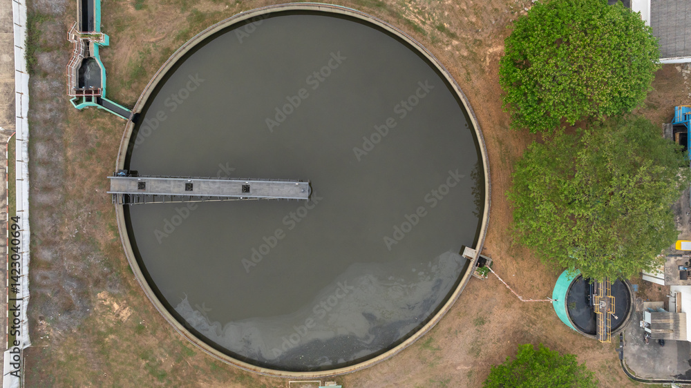 Top view black water treatment tank with waste water, Circle circular water clarifier cleaning water, Circle water treatment plant circular clarifier, Water treatment plant.