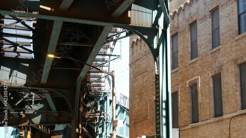 Wallpaper Mural New York elevated subway, metropolitan bridge, metro track above street. Railway transport over road. Train on railroad line. Queens public transportation. Brown brick. Long Island city, United States Torontodigital.ca