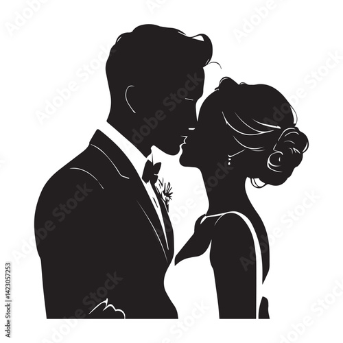 Silhouette of groom gently kissing bride’s forehead