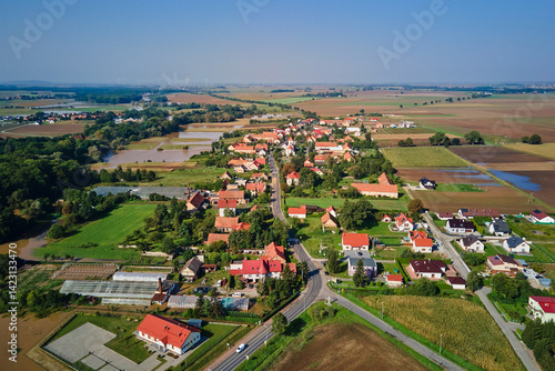 Obraz na płótnie Aerial view of rural village, flooded fields and farmland. Countryside landscape after flooding w salonie