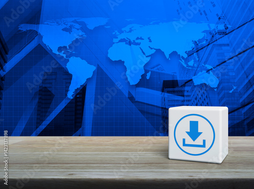 Fototapeta Naklejka Na Ścianę i Meble -  Download icon on white block cube on wooden table over world map, modern office city tower and skyscraper, Technology internet online concept, Elements of this image furnished by NASA