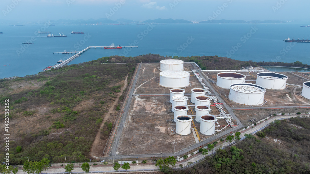 Oil terminal industrial facility storage tank, Oil storage tank with oil terminal port loading arm cargo oil product tanker ship, Global business refinery industry commercial port.