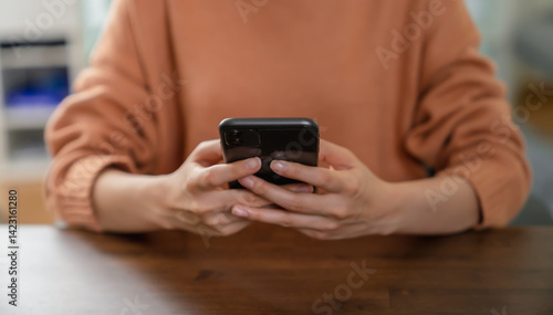 Hand holding smartphone with using social media.